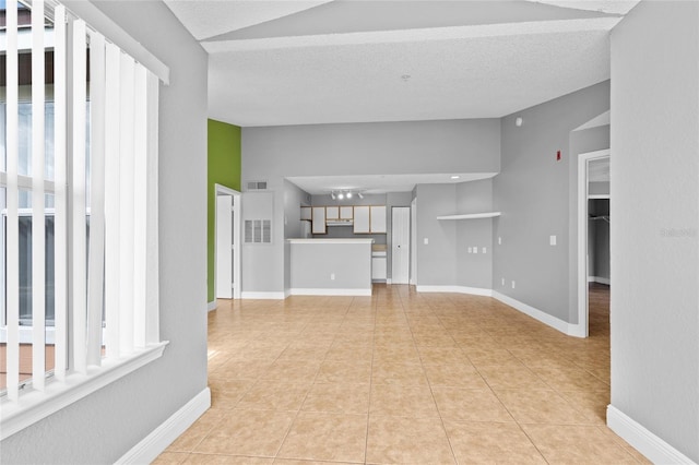 2217 Grand Cayman Ct Unit 1233, Kissimmee, FL 34741 - unfurnished living room with light tile patterned floors