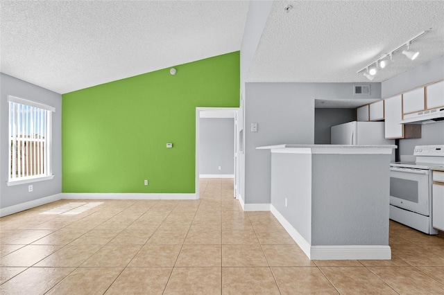 2217 Grand Cayman Ct Unit 1233, Kissimmee, FL 34741 - kitchen with white appliances, a textured ceiling, under cabinet range hood, rail lighting, and light tile patterned floors