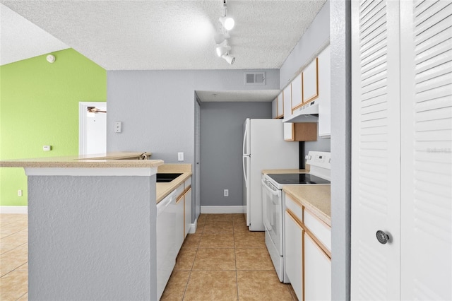2217 Grand Cayman Ct Unit 1233, Kissimmee, FL 34741 - kitchen with white appliances, a peninsula, under cabinet range hood, light tile patterned flooring, and a textured ceiling