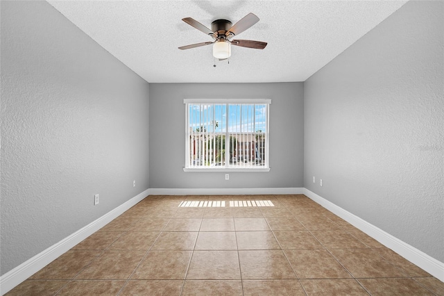 2217 Grand Cayman Ct Unit 1233, Kissimmee, FL 34741 - tiled empty room featuring a ceiling fan, a textured ceiling, and a textured wall