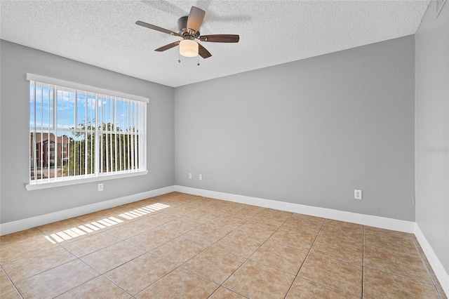 2217 Grand Cayman Ct Unit 1233, Kissimmee, FL 34741 - empty room featuring a textured ceiling, a ceiling fan, and tile patterned floors