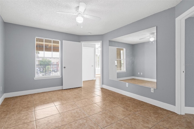2217 Grand Cayman Ct Unit 1233, Kissimmee, FL 34741 - unfurnished room featuring ceiling fan, a textured ceiling, and tile patterned floors