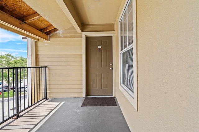 2217 Grand Cayman Ct Unit 1233, Kissimmee, FL 34741 - entrance to property with a balcony and stucco siding
