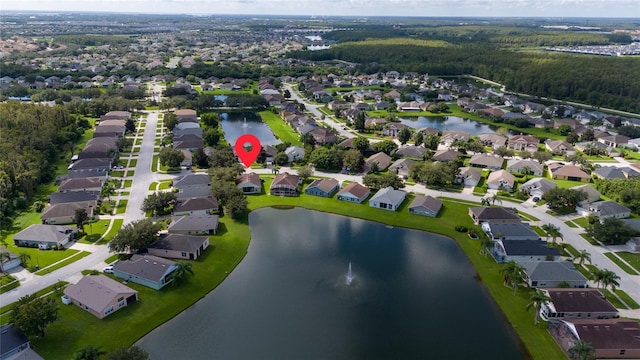 birds eye view of property featuring a water view and a residential view