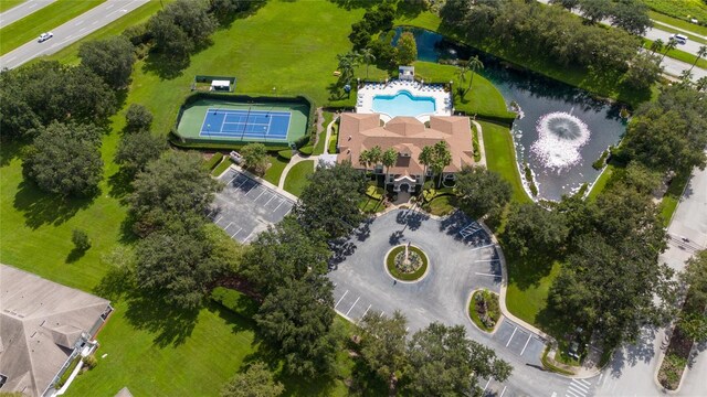 birds eye view of property with a water view