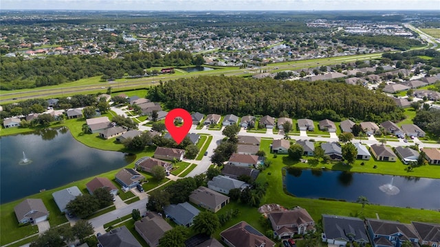 aerial view featuring a water view and a residential view