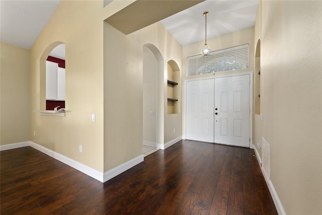 foyer entrance with dark hardwood / wood-style floors