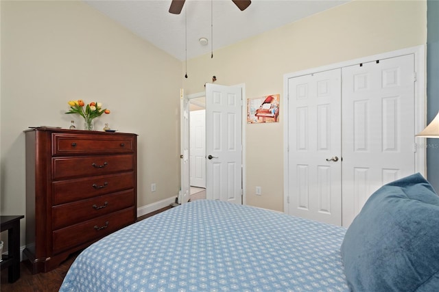 bedroom featuring lofted ceiling, baseboards, a ceiling fan, and a closet