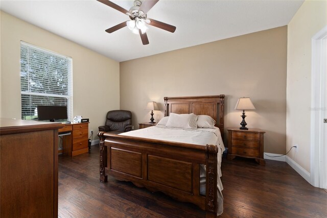 bedroom with ceiling fan and dark hardwood / wood-style flooring