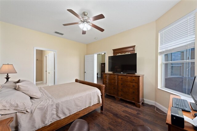 bedroom with ceiling fan and dark hardwood / wood-style floors