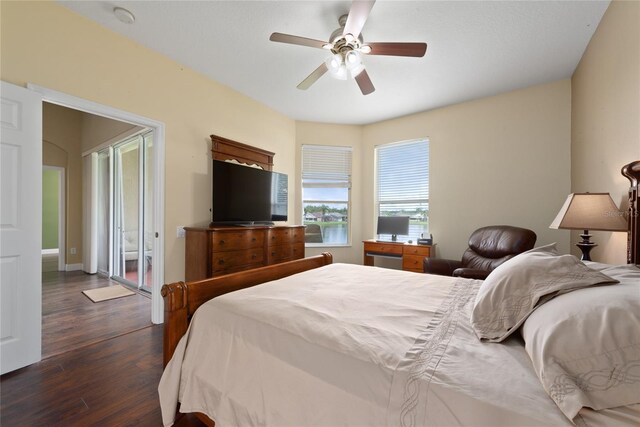 bedroom with dark wood-type flooring and ceiling fan