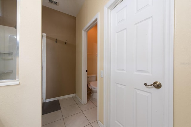 full bathroom with visible vents, a shower, baseboards, toilet, and tile patterned flooring