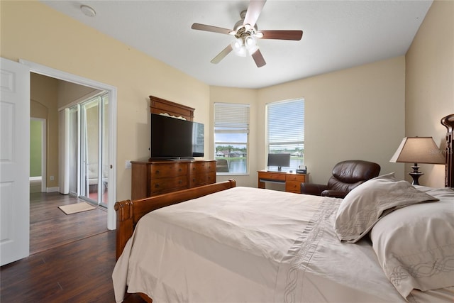 bedroom featuring dark wood-type flooring, baseboards, and a ceiling fan