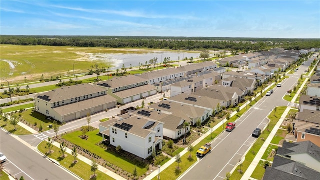 bird's eye view with a water view and a residential view