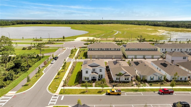 aerial view featuring a residential view and a water view