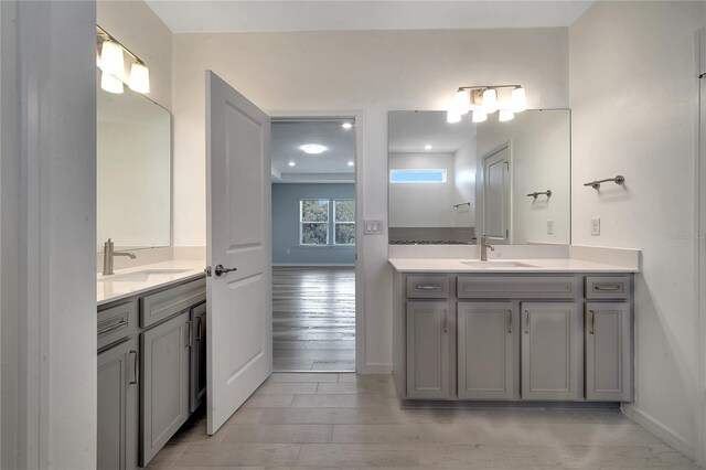 bathroom with vanity and hardwood / wood-style flooring