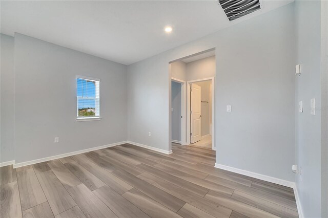 spare room with light wood-type flooring