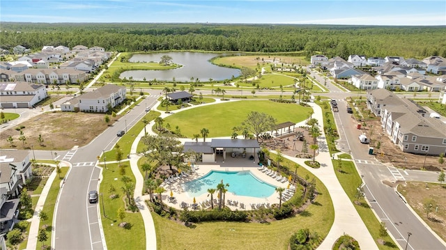 bird's eye view featuring a forest view, a water view, and a residential view