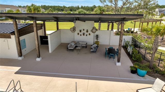 view of patio featuring fence