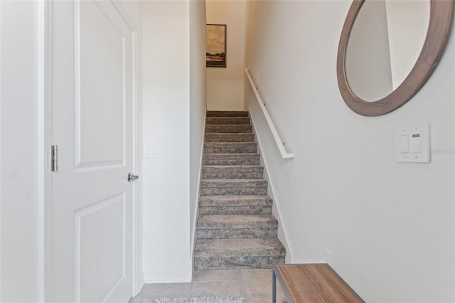 staircase with tile patterned flooring