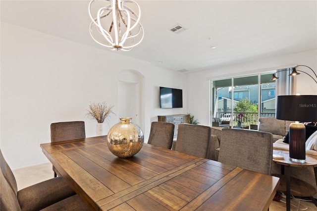 dining area with a notable chandelier