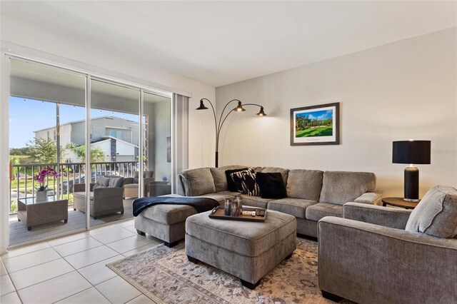 tiled living room featuring a healthy amount of sunlight