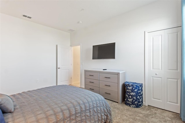 carpeted bedroom featuring a closet