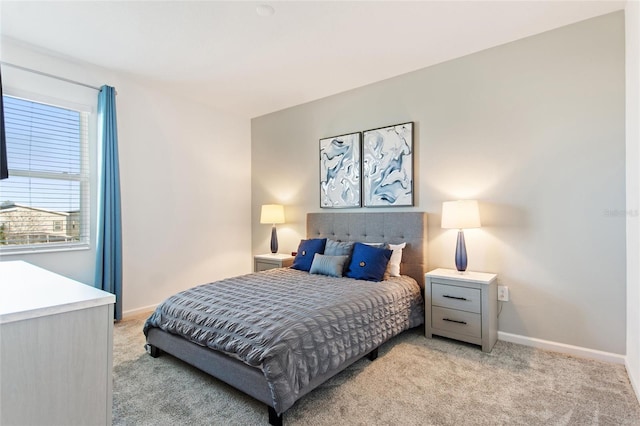 bedroom featuring light carpet