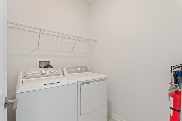 laundry room featuring washing machine and clothes dryer