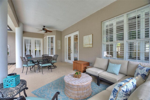 view of patio with french doors, an outdoor living space, and ceiling fan