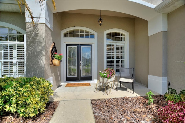 property entrance featuring french doors