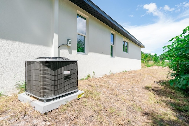 view of home's exterior featuring central air condition unit