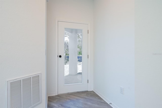 entryway with hardwood / wood-style floors