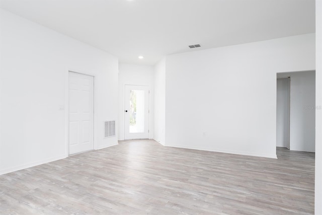 spare room with light wood-type flooring