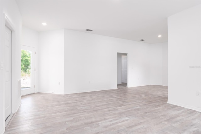 unfurnished room with light wood-type flooring