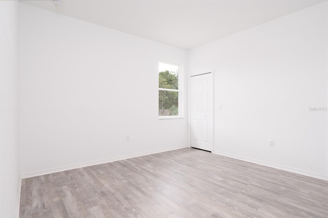 spare room featuring light hardwood / wood-style floors