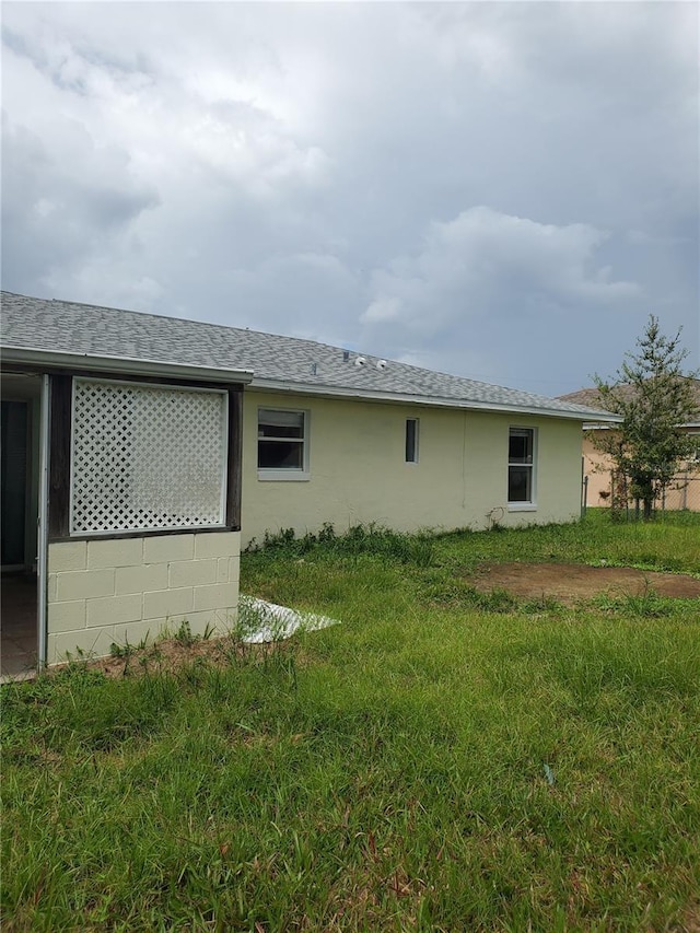 view of property exterior featuring a lawn