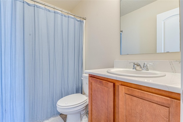 bathroom featuring vanity, toilet, and a shower with shower curtain