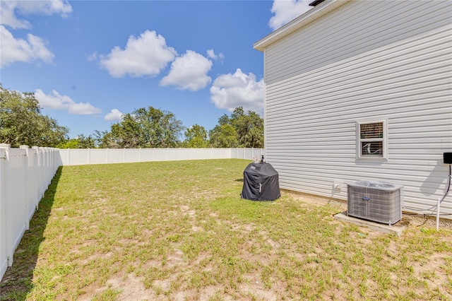 view of yard featuring central air condition unit