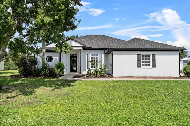 ranch-style home featuring a front yard