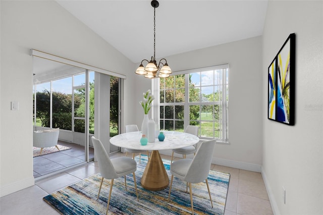 dining area featuring lofted ceiling, plenty of natural light, and an inviting chandelier