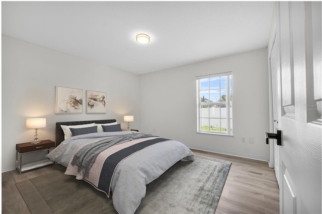 bedroom featuring hardwood / wood-style floors