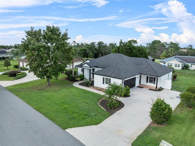 view of front facade with a garage and a front lawn