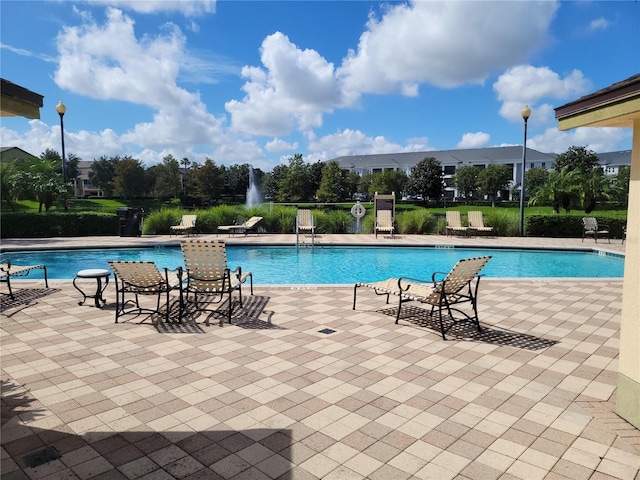 view of swimming pool featuring a patio area