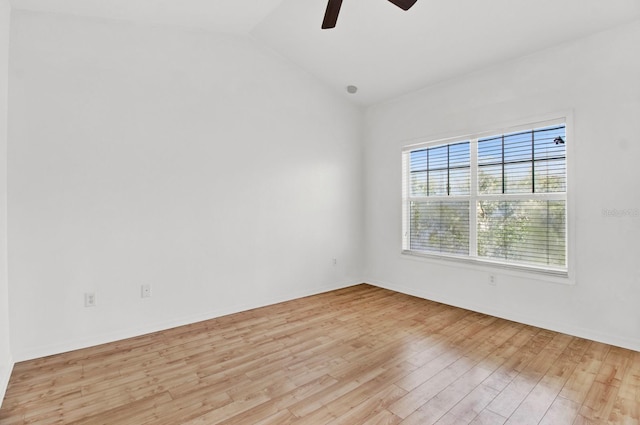 unfurnished room with light hardwood / wood-style flooring, lofted ceiling, and ceiling fan