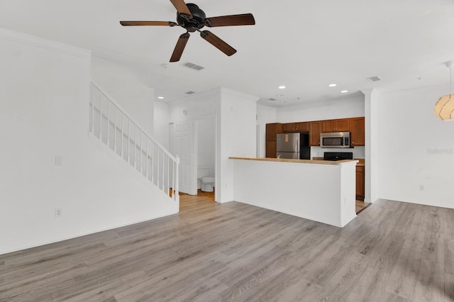 unfurnished living room featuring light hardwood / wood-style flooring and ceiling fan