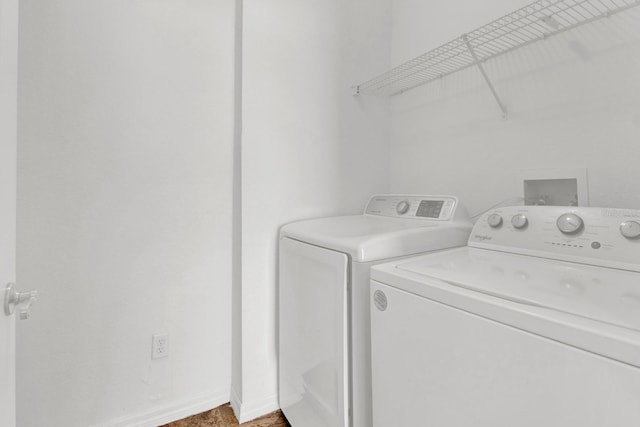 washroom with independent washer and dryer