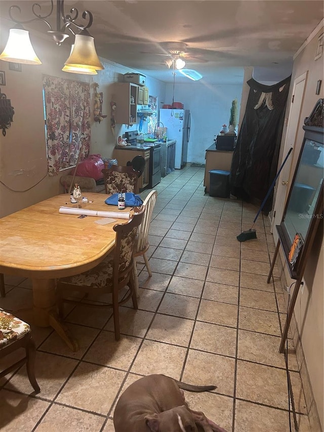 dining space featuring light tile patterned floors