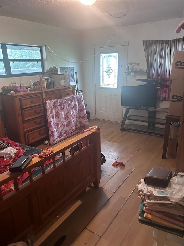 bedroom with wood finished floors