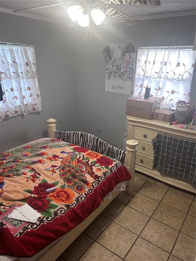 bedroom with light tile patterned floors and ceiling fan